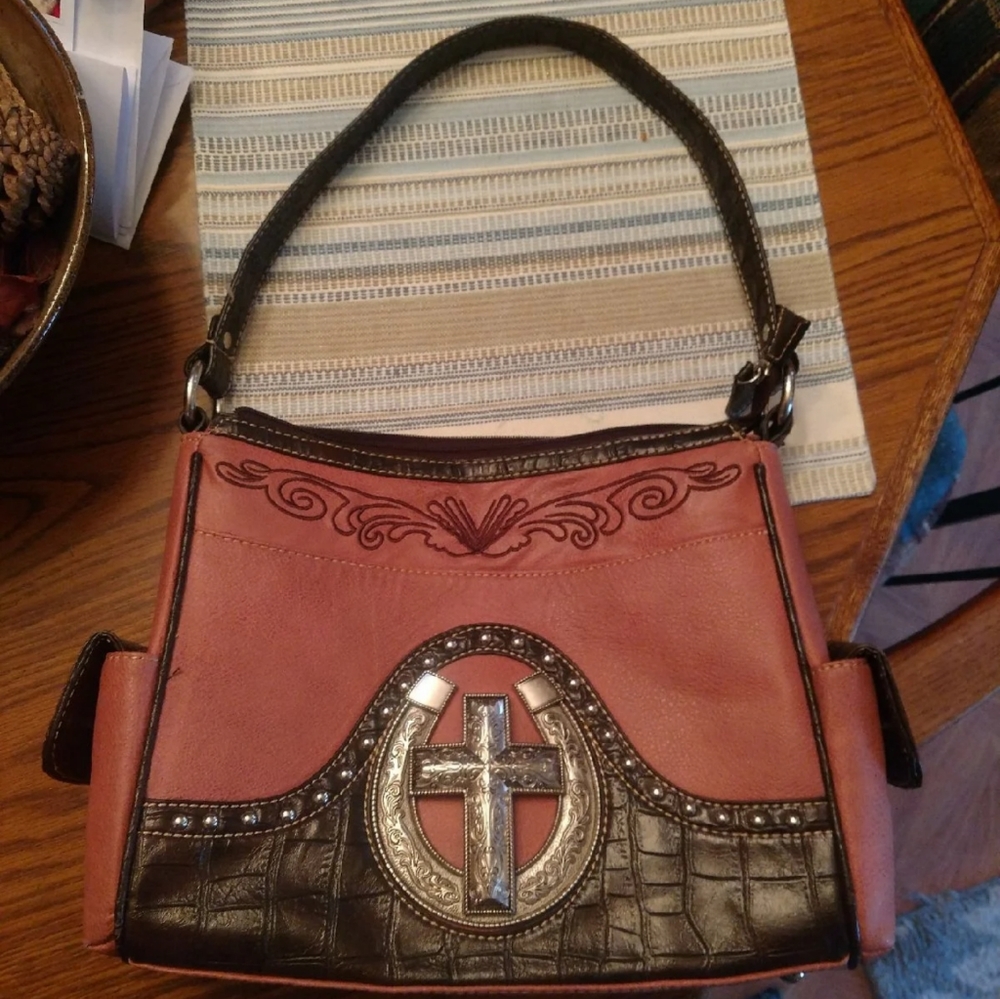 P & G horseshoe and cross leather bag
